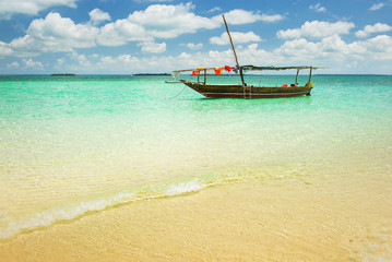 Fototapeta na wymiar alone tourism boat on the beach on Zanzibar island in Tanzania