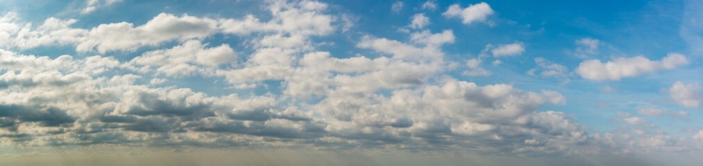 Fototapeta premium Fantastic soft clouds against blue sky, natural composition - panorama