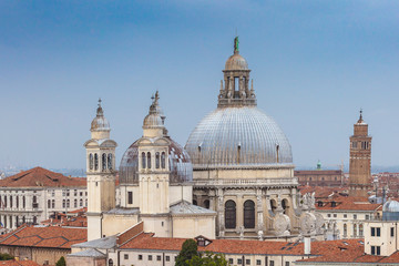 Fototapeta na wymiar Aerial view of Basilica della salute domes and venetian roofs, Venice, Italy