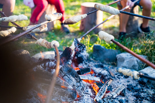 Bonfire at oudoor festival with grilled bread in the summer