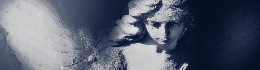Death. Sad angel as symbol of pain and end of life. Ancient statue.
