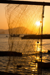 Fishing net at sunset in the small fishing village of Klima in Milos, Greece