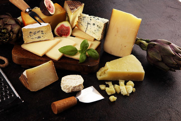 Different sorts of cheese. Cheese platter with different cheese and spice