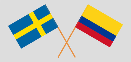 Crossed flags of Colombia and Sweden