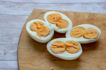 boiled egg isolated on wood background cutout