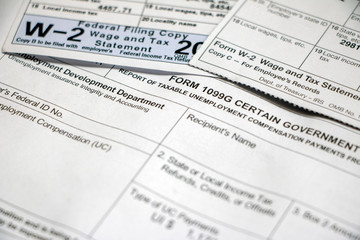 Closeup of overlapping tax forms, 1099G and W-2
