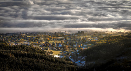 Fototapeta premium Sunrise and Inversion at Jested mountain close town Liberec, Czech republic, snow and winter and view of funicular.