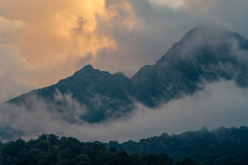 Mountain landscape after sunset. Low cloud. Beautiful sky