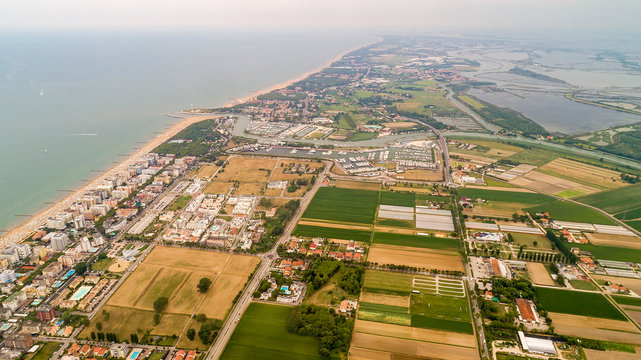 aerial view on Lido di Jesolo, Venezia, ITALY. WATER THEME PARK. Resort town in north of Italy. Resorts of Adriatic Sea. Dream panorama of Lido di Jesolo. View of city with beach crowded. summer day
