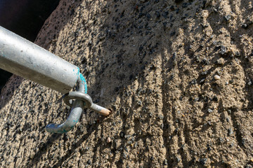 Exterior wall with hooks for scaffolding, close-up view