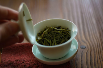 Tea ceremony. Teapot and bowls with Chinese tea on a wooden table. Drink, traditional, japan, health, beads, buddha, asia, asian, background, bamboo, beverage