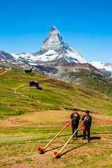 Swiss alphorn blowers in Switzerland - obrazy, fototapety, plakaty