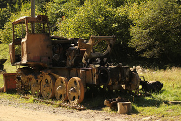 Obraz premium HDR image of old rusty tractor in a field.