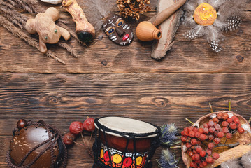 Shaman accessories on wooden table background. Magic equipment concept.