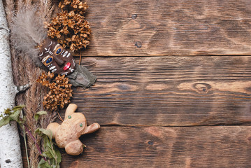 Shaman accessories on wooden table background.