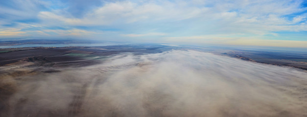 Aerial landscape. Fog above the fields. Bird eye view landscape.