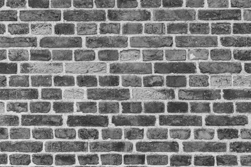 Dekorative alte Backsteinmauer in schwarz weiss
