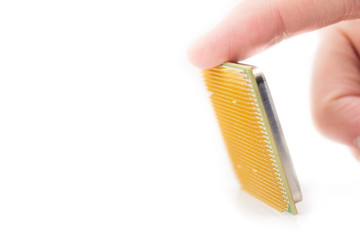 computer CPU in hand close-up isolated on white background