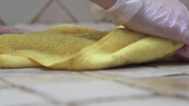 Cleaning a Tiled Floor with a Wash Cloth