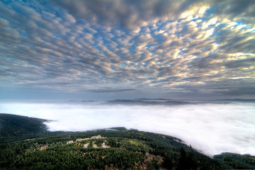 Sunrise and Inversion at Jested mountain close town Liberec, Czech republic, snow and winter and...