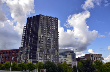 Amsterdam, Holland, August 2019. In the modern periphery of the city a building with a large roof...
