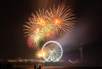 Colorful Fireworks at the Scheveningen Pier with a Ferris wheel , Den Hague the Netherlands