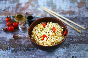 Chinese noodle bowl with spices. Food sticks. Selective focus.