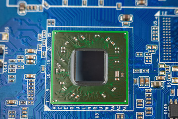a chip in a computer with many electrical elements, a CPU, a GPU, a microchip in an electronic...