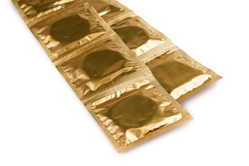 packaging with condoms isolated on a white background, the concept of protection against sexually transmitted diseases, unwanted pregnancy, sexual education in educational institutions