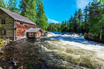 Wooden hut in the border of Yattumutka river in Myllykoski point of Pieni Karhunkierros Trail in Finish Oulanka National Park.