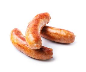 Tasty grilled sausages on white background