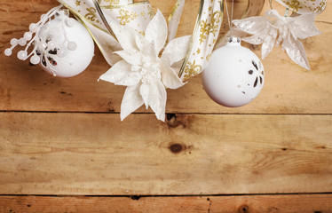 Fototapeta na wymiar white christmas decorations over wooden background