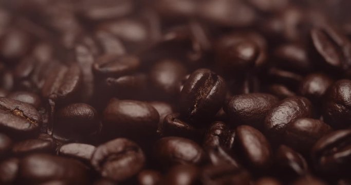 Close-up of fresh roasted dark brown espresso coffee beans