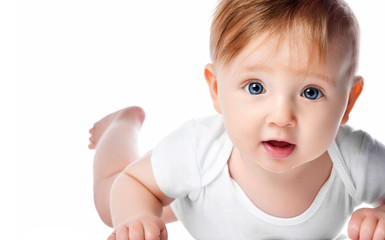 Infant child baby boy kid with blue eyes happy smiling screaming lying on a floor isolated on a...