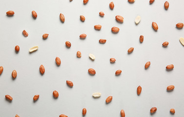 Tasty peanuts on light background