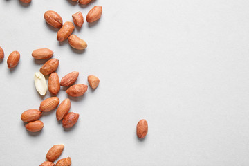 Tasty peanuts on light background