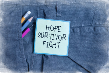 Text sign showing Hope Survivor Fight. Business photo showcasing stand against your illness be fighter stick to dreams Writing equipment and green note paper inside pocket of man work trousers