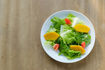 Mix salad vegetable  in white dish,vegan copy space