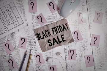 Text sign showing Black Friday Sale. Business photo showcasing Shopping Day Start of the Christmas Shopping Season Writing tools, computer stuff and scribbled paper on top of wooden table