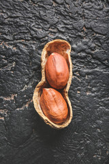 Raw peanut on dark background