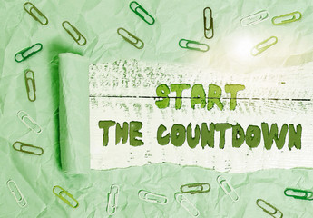 Writing note showing Start The Countdown. Business concept for Sequence of Backward Counting to Set the Timer Paper clip and torn cardboard on wood classic table backdrop