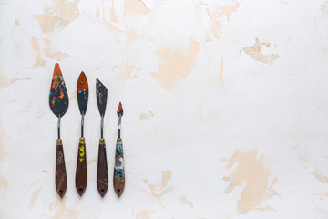 Set of palette knives on light background