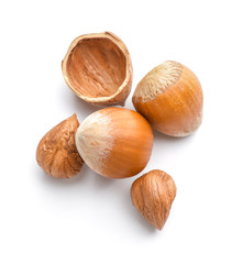 Tasty hazelnuts on white background