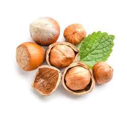 Tasty hazelnuts on white background