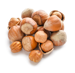 Tasty hazelnuts on white background