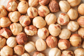 Many tasty hazelnuts as background