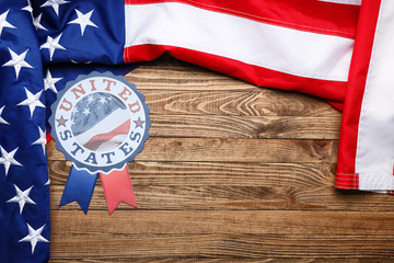 USA flag and emblem on wooden background with space for text