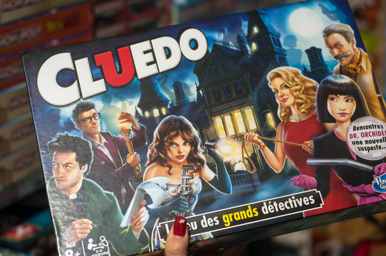 Mulhouse - France - 7 December 2019 - Closeup of cluedo game in hand of woman in a toy store supermarket