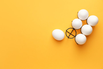 Fresh raw eggs on color background