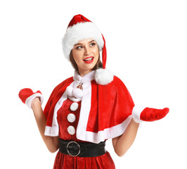 Beautiful young woman in Santa costume on white background